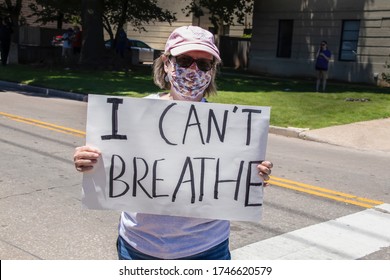 05-30-2020 Tulsa USA Woman In Pink Ball Cap And Printed Mask Holding Sign Reading I Cant Breathe Standing In Middle Of Road