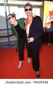 05DEC99: Pop Star BRIAN SETZER & Wife At The World Premiere In Los Angeles Of 