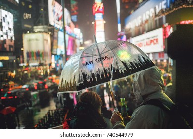 06,05,2017 NEW YORK CITY: New York Times Square People With Rain Umbrellas