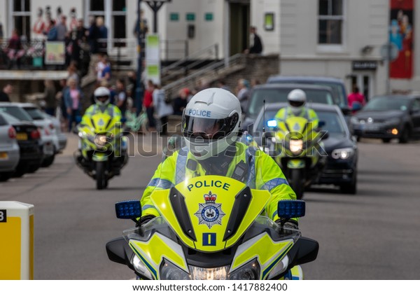 06/06/19 Portsmouth, Hampshire,\
UK british police motorbike outriders travel infront of a motorcade\
