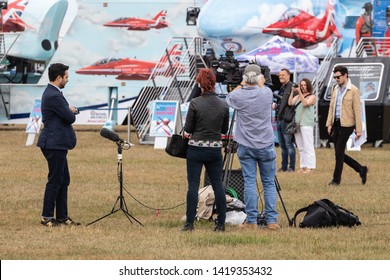 06/06/19 Portsmouth, Hampshire, UK A Film Crew With A Reporter And A Cameraman Setting Up To Film An Outside Broadcast 