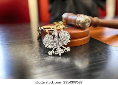 06.07.2023 wroclaw, poland, Polish court trial law insignia lies on the bench.