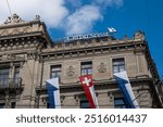 06-09-2024 Zurich, Switzerland. Credit Suisse bank headquarters building at Paradeplatz. Sunny summer day, wide angle street view