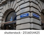 06-09-2024 Zurich, Switzerland. Paradeplatz and Bahnhofstrasse street sign on the Credit Suisse bank building street corner or intersection. Low angle, no people.