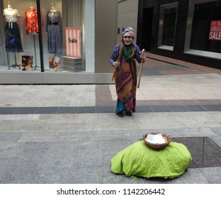 06/14/2018. Busking Is Very Common On Grafton Street, Dublin. The Image Shows An Asian Native Dancer Entertaining Passers-by.