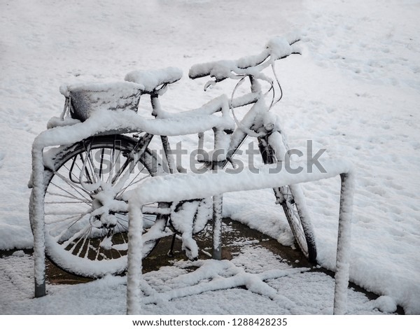 0615 Bike at\
bike rack, snowed, covered in\
snow