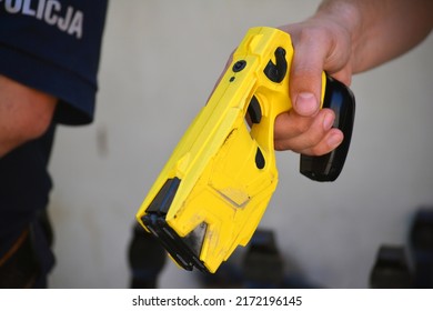 06.24.2022 Wroclaw, Poland, A Policeman On Duty With An Electric Stun Gun. Tazer. Taser