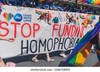 06.25.2022 Warsaw, Poland - Stop Funding Homophobia. Big White Banner Held By Equality Parade Participants Who Are Fighting For LGBTQAI Rights. High Quality Photo