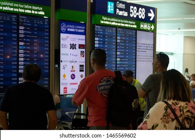 Cancún/Mexico- 06/29/2019: Passengers Monitor Incoming Flights At The Departures Board Inside Cancún International Airport.