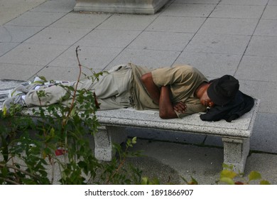 07.08.2007 Chicago, USA. A Black Homeless Man Sleeps On A Bench In The Park.