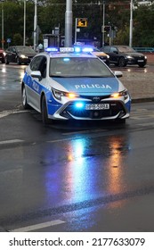 07.11.2022 Wroclaw, Poland, Polish Police Car In The Evening With A Blue Flashing Light On The Roof. Night Patrol.