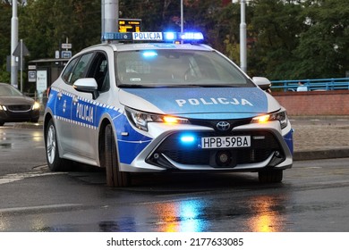 07.11.2022 Wroclaw, Poland, Polish Police Car In The Evening With A Blue Flashing Light On The Roof. Night Patrol.