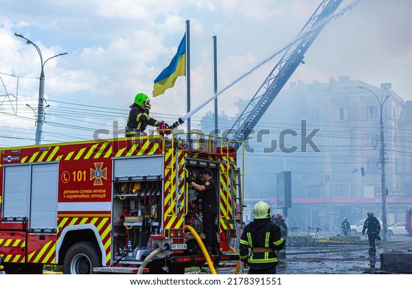 07-14-2022 Vinnytsia, Ukraine. fire extinguishing\
after a rocket hit a houses in Vinnytsia. russian rocket destroyed\
building in a peaceful city of Ukraine. Consequences of war.\
firemen by car works