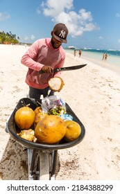 07.24.2022. Dominican Republic, Punta Cana Bavaro. Coconut Seller On The Beach.