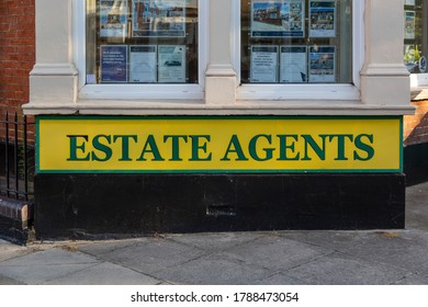 08/02/2020 Portsmouth, Hampshire, UK The Front Or Exterior Of An English Estate Agents With An Estate Agent Sign Underneath The Window