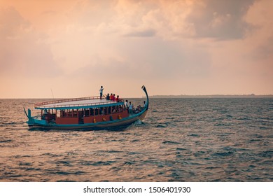 08.13.19 - Faafu Atoll, Maldives: Wonderful Maldivian boat Dhoni on tropical blue sea, taking tourist to a sunset cruise. 