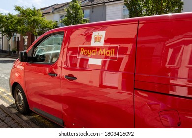08/24/2020 Portsmouth, Hampshire, UK the side of a red Royal mail van with houses reflecting in the paintwork