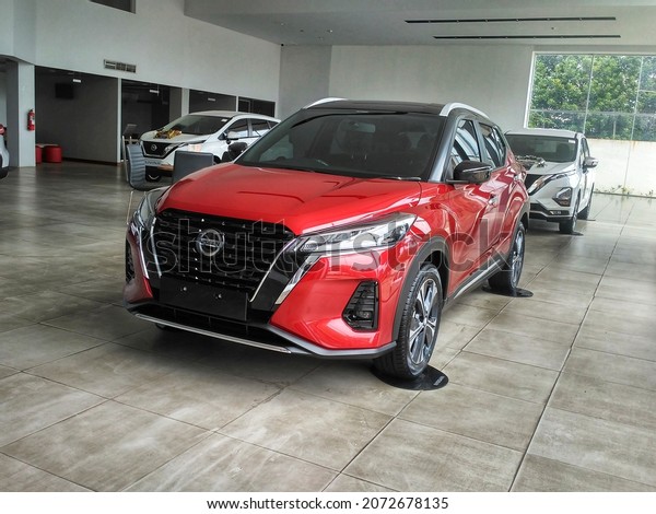 09\
November 2022, the city of Jakarta Indonesia, a red Nissan Kick car\
in a show room in the city of Jakarta\
Indonesia