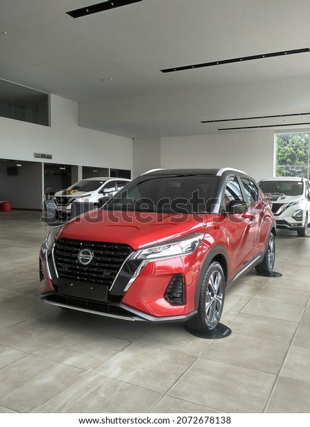 09\
November 2022, the city of Jakarta Indonesia, a red Nissan Kick car\
in a show room in the city of Jakarta\
Indonesia