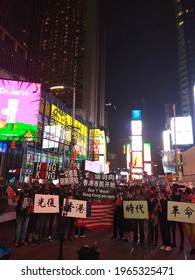 09.11.2019; New York, USA: A Manifestation For The Rights Of People Of Chinese Origin In Times Square. People Carry Protest Banners