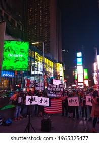 09.11.2019; New York, USA: A Manifestation For The Rights Of People Of Chinese Origin In Times Square. People Carry Protest Banners