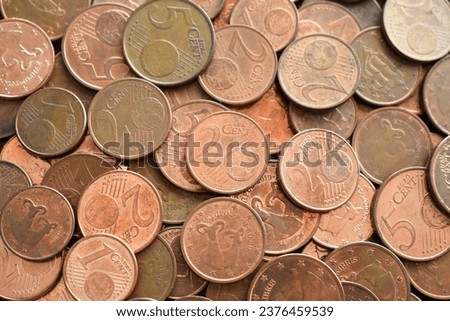 1 cent euro coins, 2 cent euro coins and 5 cent euro coins. Pile of euro cent coins.