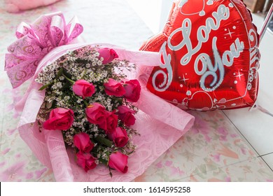 1 Dozen Pink Roses In A Bouquet With I Love You Balloon