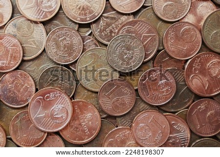 1 euro cent coins and 2 euro cent coins. Euro cent coins background. Pile of euro cent coins.