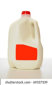 1 Gallon Of Milk In A Milk Carton On A Shiny Table With White Background.