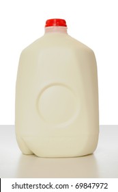 1 Gallon Of Milk In A Milk Carton On A Shiny Table With White Background.