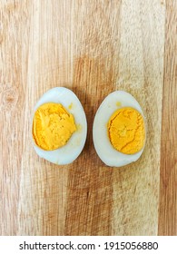 1 Hard Boiled Duck Egg On A Cutting Board, Cut In Half