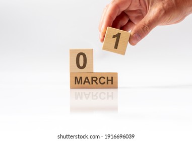 1 March inscription on wooden calendar. Hello spring.