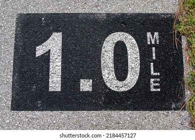 1 Mile Marker On Asphalt Hiking Biking Path