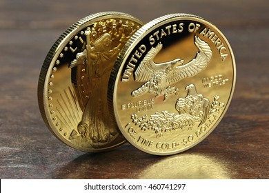 1 Ounce American Gold Eagle Bullion Coins On Wooden Background