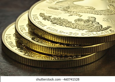 1 Ounce American Gold Eagle Bullion Coins On Wooden Background