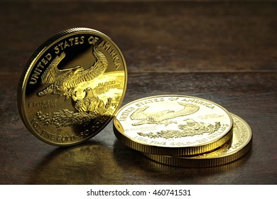 1 Ounce American Gold Eagle Bullion Coins On Wooden Background