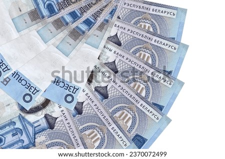 10 Belorussian rubles bills lies isolated on white background with copy space stacked in fan shape close up. Financial transactions concept