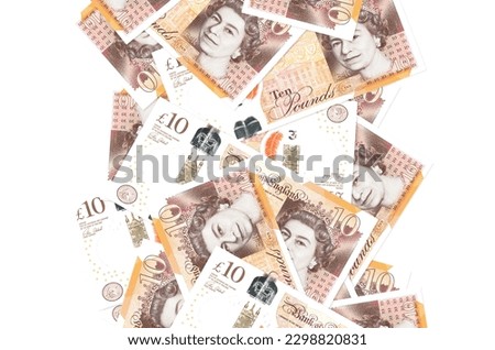 10 British pounds bills flying down isolated on white. Many banknotes falling with white copy space on left and right side