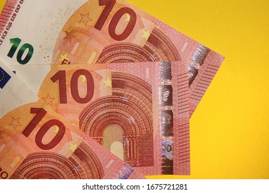 10 Euro banknote on yellow background  - Shutterstock ID 1675721281