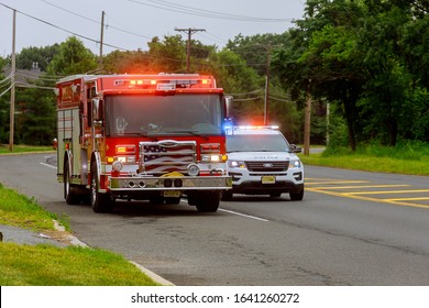 10 February 2020 East Brunswick NJ USA: Fire Trucks In Fire Department On Emergency 911 And Police Car