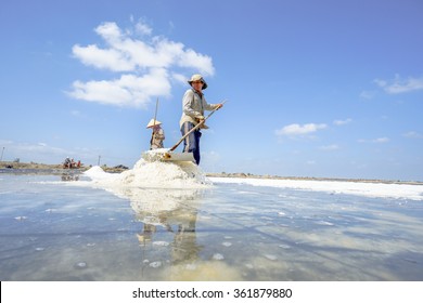 10 JAN 2016: Unidentified man works in salt field in Can Gio, Vietnam. 