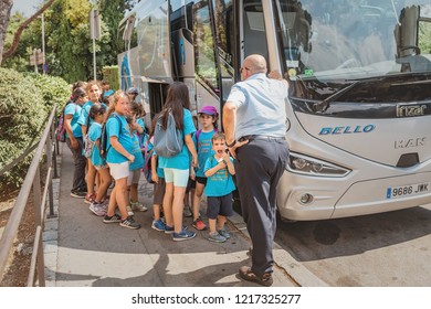 10 JULY 2018, BARCELONA, SPAIN: Group Of Happy Kids On A School Excursion Near The Bus