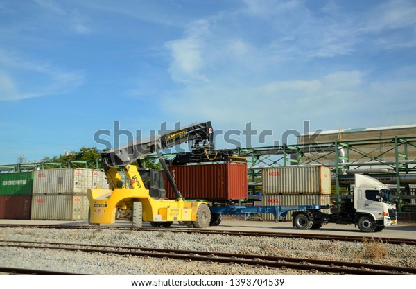 10 May 2019 in Map Ta Phut Industrial Estate, Rayong\
City, Thailand. Shipping and transport containers or cargo from\
train to truck, for support the production of petrochemical\
industrial estates area
