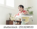 10 month old boy walking with a walker