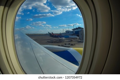 10 October Kiev Borispol aeroport Loading cargo on plane in airport. cargo plane loading for logistic and transport. view through window