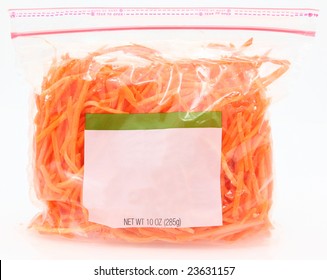 10 Oz Bag Of Carrots Cut Matchstick Style Over White.  Blank Label For Text.