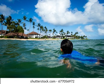 10 Year Old Boy Swimming At Kiahuna Beach, Poipu Beach In Front Of Sheraton, Kauai, Hawaii, USA, Sunny Summer Day