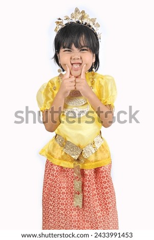 a 10 year old Indonesian girl wearing traditional clothes from Palembang. Isolated on White Background