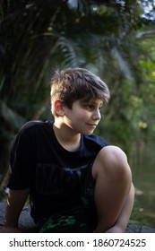 
10 Year Old White Boy With Light Brown Hair Portrayed In The Park. Happy Child.