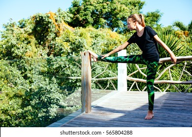 10 Years Old Kid Girl Doing Yoga Asana In The Nature.